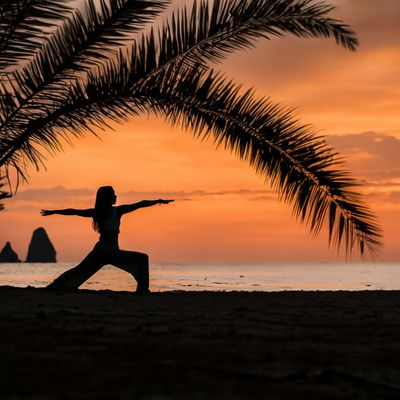 Abstract yoga pose silhouette in dark room